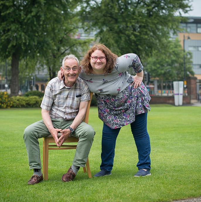 Photo from the L'Arche International meeting in Belfast in 2018 of a man and woman smiling outside