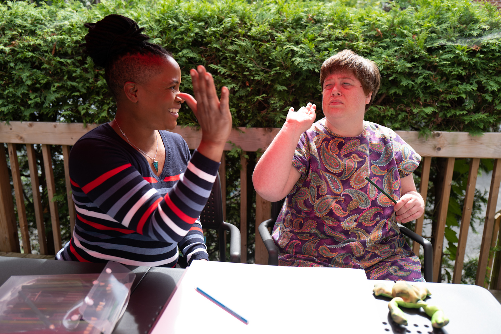 Two women high fiving